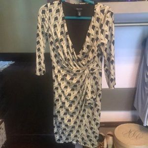 Printed black faux wrap dress, belted.